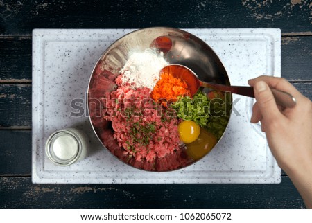Chef Mixing Ingredient of Meat Loaf in a Bowl Cooking Process