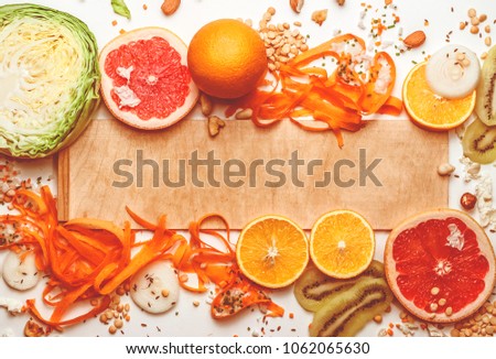 fresh vegetables, fruits, nuts on a light background