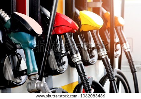 red green yellow orange color fuel gasoline dispenser  background Royalty-Free Stock Photo #1062083486