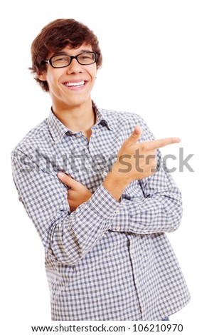 Smiling latin student with black glasses showing forefinger on something. Isolated on white background, mask included