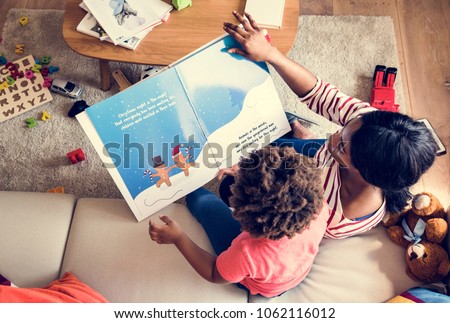 Mom reading picture book with her son