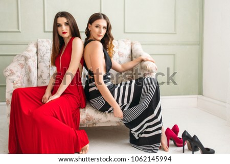The beautiful girls sitting on the sofa