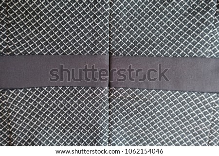 Chocolate stripe sewn to the grey fabric