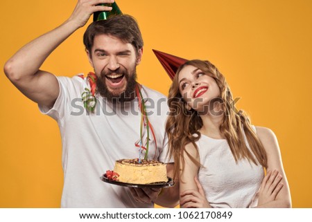  joyful young couple, celebrates birthday, party                              