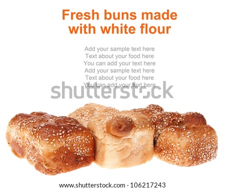 fresh loaf of light wheat bread topped by sesame seeds isolated over white background