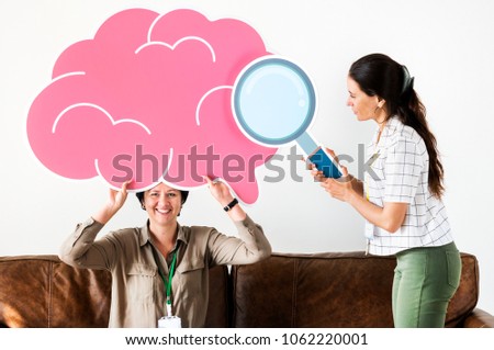 Women holding pink cloud icons
