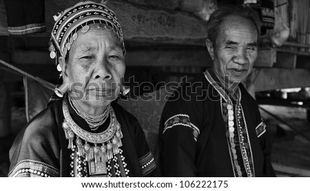 Thailand, Chiang Mai, Karen Long Neck hill tribe village (Kayan Lahwi), Karen couple in traditional costumes