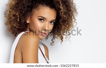 Portrait of beautiful black woman isolated  Royalty-Free Stock Photo #1062227855