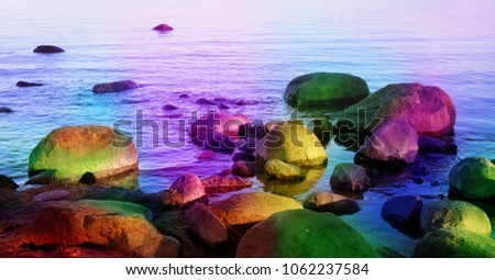 Colorful, magical fantasy theme edited landscape including rocks and the sea. Beautiful rainbow colored picture of nature. 