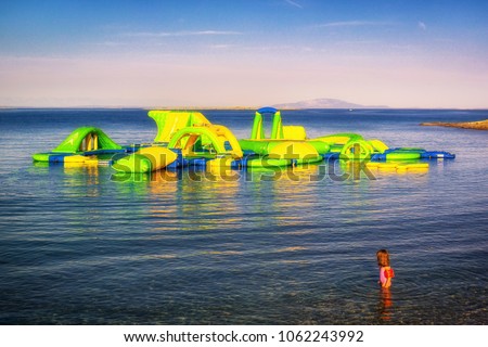 Bouncy Castle On Blue Sea Background