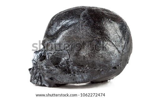 The skull of a man in silver is made of rubber.