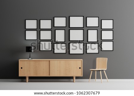 Blank group of  picture frame for insert text or image inside on wood table in living room.
