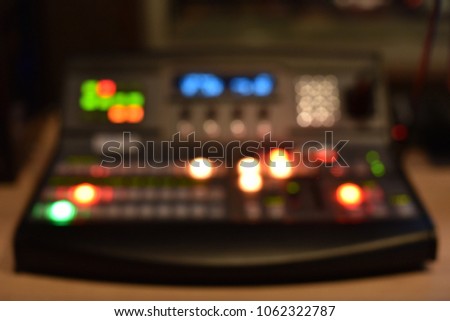 video mixing system console in blur defocused background
