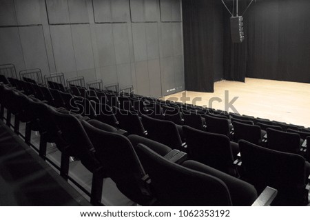 black theater with empty chairs 