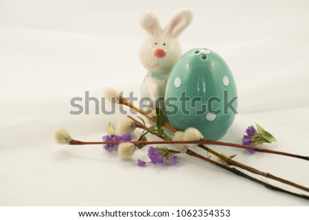 Easter bunny, egg, spring flowers.