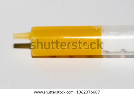 injection with yellow juice