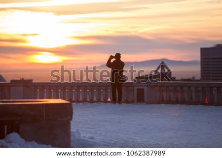 Photographer taking picture of Montreal sunset