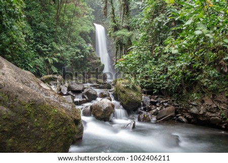 La Paz Waterfall located just outside San Jose Costa Rica Royalty-Free Stock Photo #1062406211