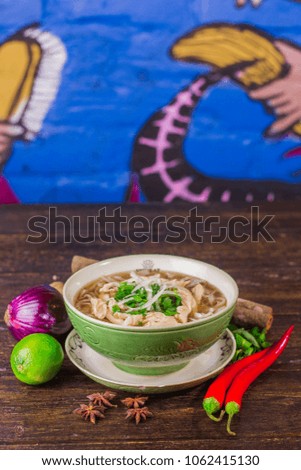 Vietnamese chicken soup pho on colorful background