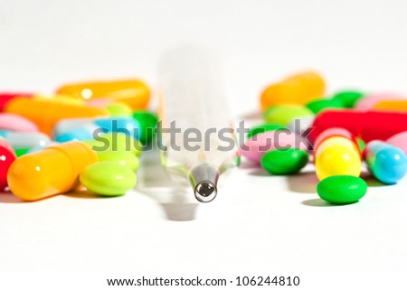 thermometer with drugs on white background