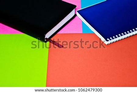 Books on colored background close-up