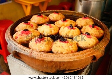 Torrejas, are a traditional food in Guatemala. They are made with sweet bread stuffed with custard, fried and drowned on a light sauce of water, sugar and other ingredients. Royalty-Free Stock Photo #1062484061