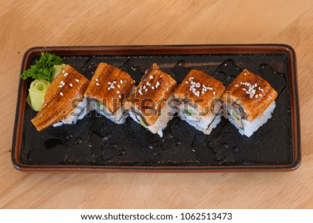 Close up Unagi Sushi rolls on wooden table.Famous food of Japan.Top view.Healthy Food have protein and omega 3.