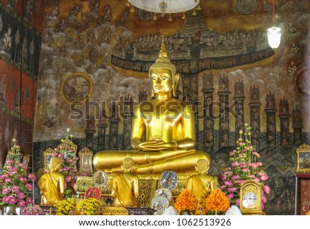 The very beautiful principle Buddha image in a temple in Thailand and Thai style wallpaper.