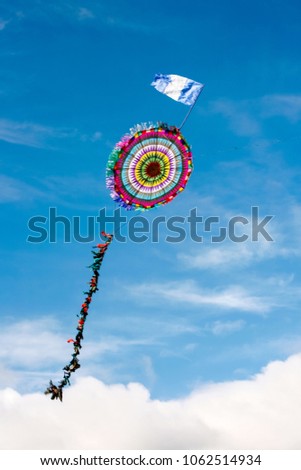 All Saints Day in Santiago Sacatepequez Guatemala, an important festivity that takes place on the town cemetery with beautiful handmade giant and colorful kites. Royalty-Free Stock Photo #1062514934
