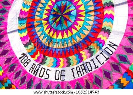 All Saints Day in Santiago Sacatepequez Guatemala, an important festivity that takes place on the town cemetery with beautiful handmade giant and colorful kites. Royalty-Free Stock Photo #1062514943