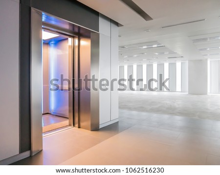 Modern elevator open doors in a empty floor, Large Hall, Store, interior,Lab, without furniture in a new building. Royalty-Free Stock Photo #1062516230