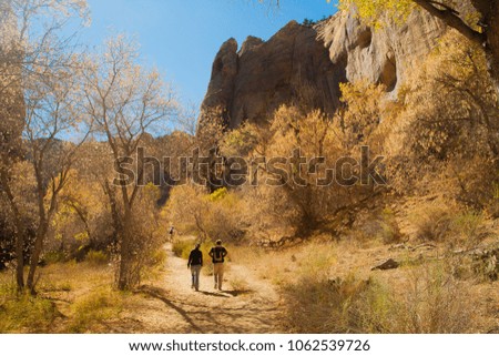 Three people hiking on the Calf Creek Trail, Grand Staircase-Escalante National Monument, Utah Royalty-Free Stock Photo #1062539726