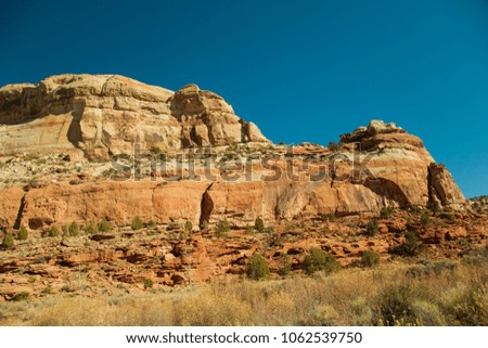 Unusual geologic rock formations viewed from Calf Creek Trail, Grand Staircase-Escalante National Monument and Zion National Park, Utah Royalty-Free Stock Photo #1062539750
