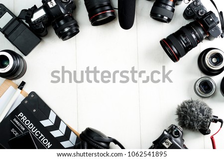 Cinema minimal concept. Watching film in the cinema. clapper board on yellow background. Screenwrite desktop Royalty-Free Stock Photo #1062541895