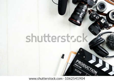 Cinema minimal concept. Watching film in the cinema. clapper board on yellow background. Screenwrite desktop Royalty-Free Stock Photo #1062541904