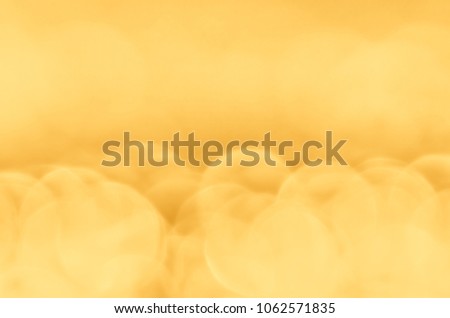 Golden bokeh background with copy space