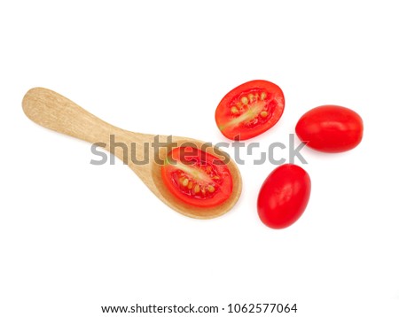 Fresh grape or cherry tomato with wooden spoon on white background.
