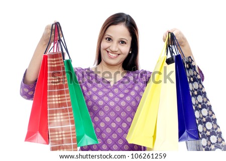 Young Cheerful Indian woman with shopping bags