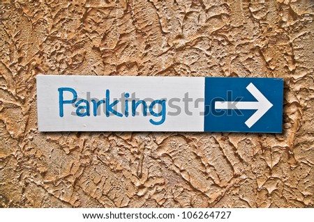 The Sign of parking on wall