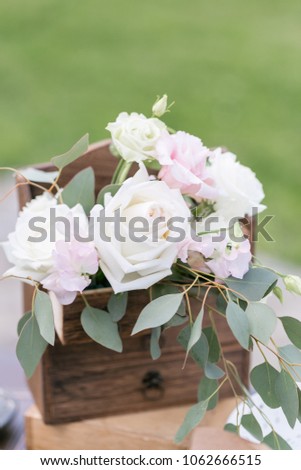 Wooden vintage Dresser, with flower decoration in garden. outdoor. selective focus