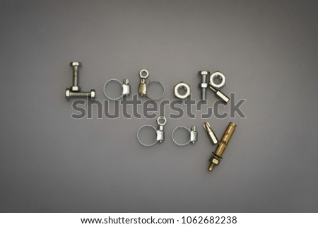 Labor day greeting card concept - Labor day texts arrangement with  bolts and nuts and others tools