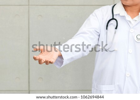 Physician or Doctor reaching hand beside out to presentation with copy space. Customer can put symbol, icon or add text on hand.