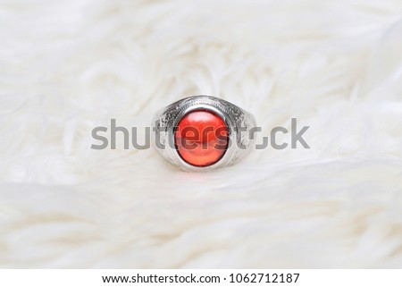 red gem on ring