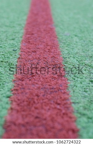 red line on a turf field