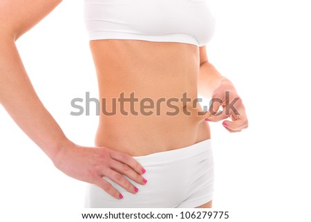 A picture of a young woman showing her belly over white background