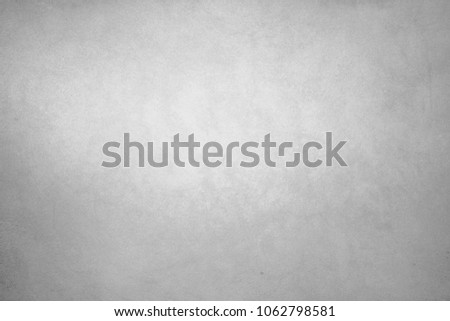 The texture of the painted surface is a smooth wall with slight impregnations of noise. Balanced white color. Designer background. Artistic plaster. Rastered digital fit. Realistic photo. Royalty-Free Stock Photo #1062798581