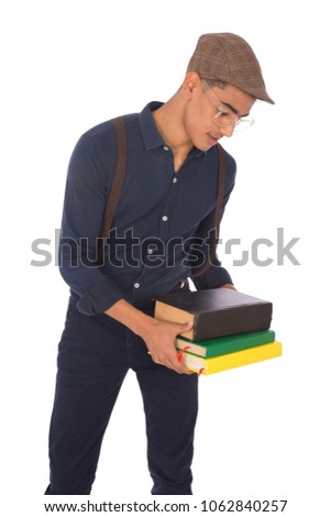 Handsome young man wearing a classic outfit and holding many books, isolated on white background