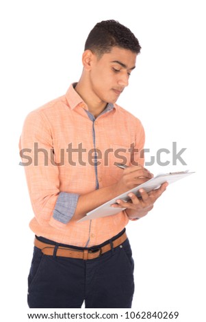 young man wearing a classic outfit and holding a pen and paper write something, isolated on white background