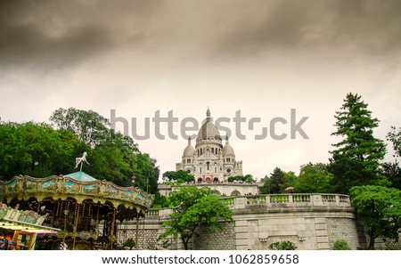 The famous Sacre Coeur Basilica in Paris and the dark clouds.