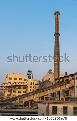 old factory with brick stack against bule sky
